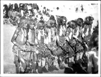 Snake priests chanting songs and swinging eagle feathers during a Snake Dance Ceremony at Oraibi, Arizona, ca.1896 (CHS-4738)