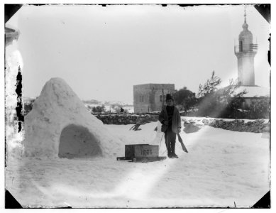 Snow in Jerusalem, 1921. Man with box on sled LOC matpc.00784