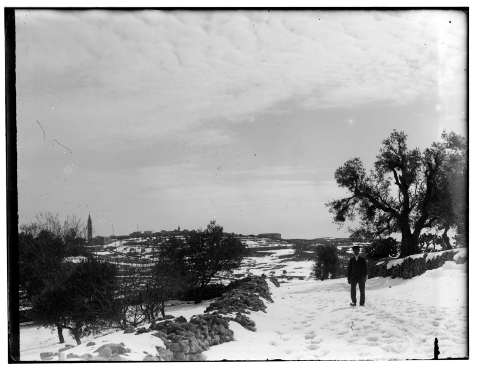 Snow in Jerusalem, 1921. View of Jerusalem from a distance with a man LOC matpc.00780