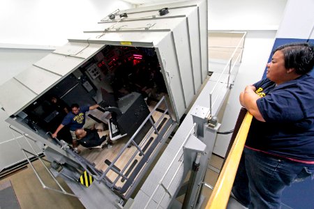 Students from Mira Mesa High School Air Force Junior Reserve Officer Training Corps (JROTC) experience a simulated emergency blow in the Ship's Control Station trainer