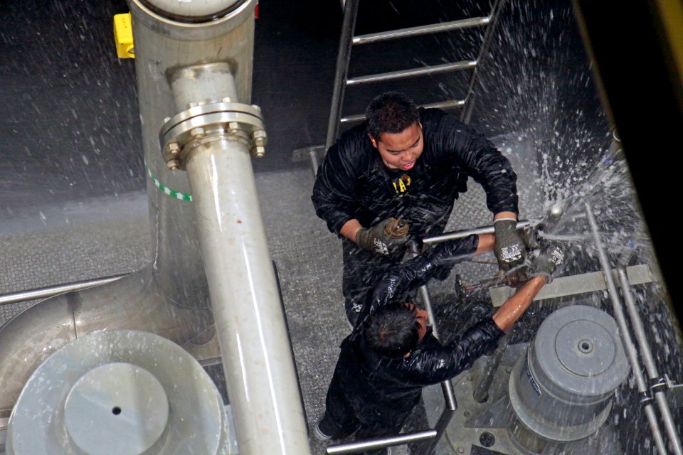 Students from Mira Mesa High School Air Force Junior Reserve Officer Training Corps (JROTC) attempt to patch a pipe