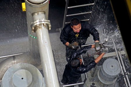 Students from Mira Mesa High School Air Force Junior Reserve Officer Training Corps (JROTC) attempt to patch a pipe photo
