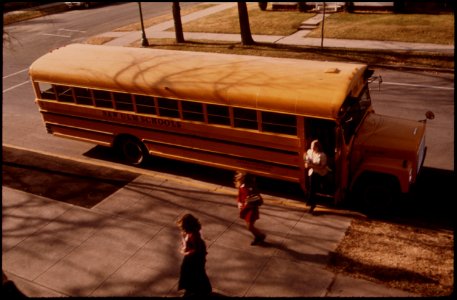 Students-arriving-by-schoolbus-at-cathedral-senior-high-school-in-new-ulm-minnesota 4726880787 o