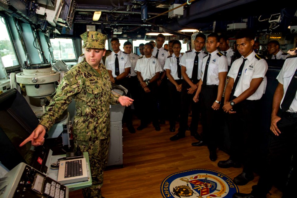 Students of the Fiji Maritime Academy tour the bridge of the USS Shoup