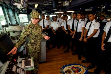 Students of the Fiji Maritime Academy tour the bridge of the USS Shoup