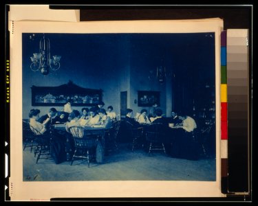 Students seated around tables, studying, at Western High School, Washington, D.C. LCCN2002695161