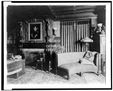 Study with portrait of woman in Elizabethan dress, over fireplace, and curved sofa at right, in home of Edmund Cogswell Converse, Greenwich, Connecticut LCCN94502503 photo