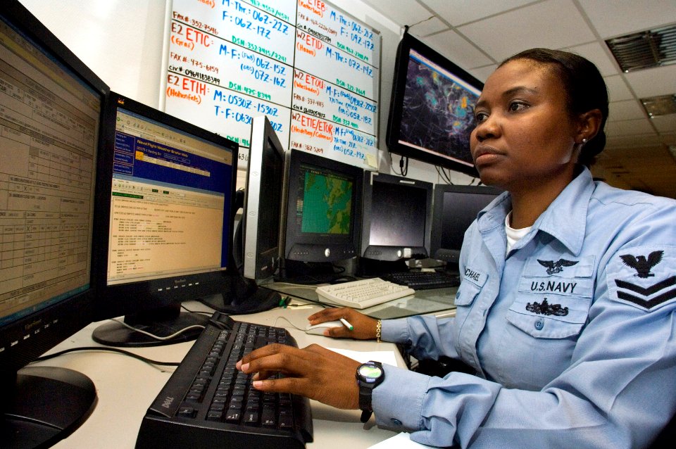 US Navy 060830-F-0994L-513 Aerographers Mate 2nd Class Evelyn Michael prepares weather briefs for air crews throughout Europe from Sembach Air Base, Germany