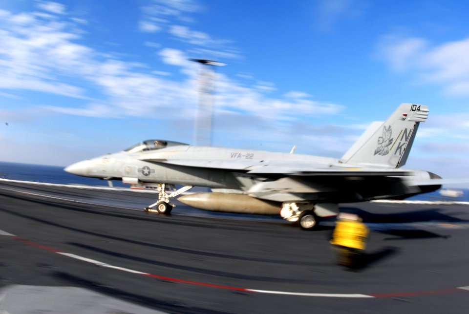 US Navy 060831-N-8158F-252 An F-A-18E Super Hornet assigned to the Fighting Redcocks of Strike Fighter Squadron Two Two (VFA-22) launches from the flight deck aboard the nuclear-powered aircraft carrier USS Nimitz (CVN 68)