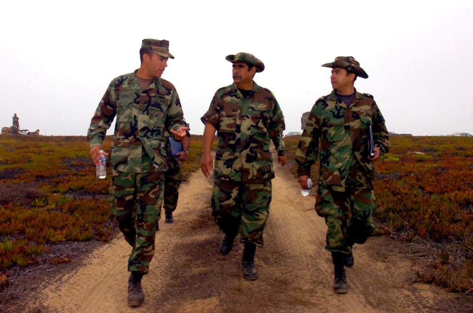 US Navy 060829-N-9818V-006 Lt. j.g. Steve Bower assigned to Naval Coastal Warfare Squadron Five (NCWRON-5), escorts officers from the Mexican Navy to observe drills at Camp Fish in support of Exercise Seahawk 2006