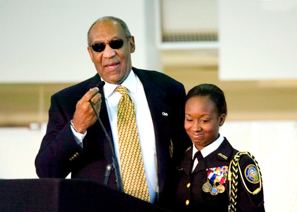US Navy 061003-N-0000K-001 Dr. William H. Bill Cosby congratulates Keisha Dewberry, a senior Navy JROTC battalion commander at Frederick Douglass High School, on her accomplishment