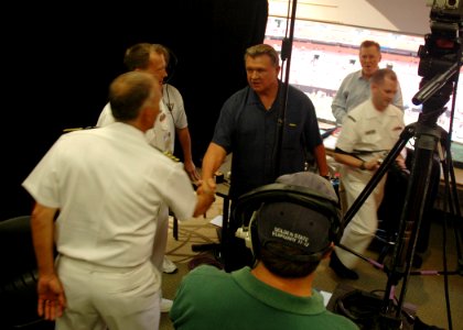 US Navy 060831-N-1805P-007 Sailors from amphibious transport dock ship USS Cleveland (LPD 7) were welcomed by legendary football coach Mike Ditka
