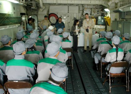 US Navy 060901-N-1332Y-326 Lt. Cmdr. David Rowland, executive officer for the U.S. Navy frigate USS Gary (FFG 51), informs Tokyo Metropolitan Government employees of the plan of action as they proceed through the Tokyo Metropol