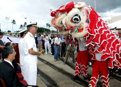 US Navy 060906-N-0879R-004 Commander, Navy Region Hawaii, Rear Adm. T. G. Alexander prepares to make an offering during a Lion Dance following the arrival of two ships representing China's Navy