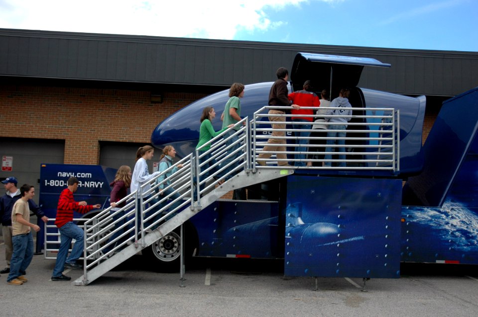 US Navy 061013-N-5531C-001 Students at Broughton High School have a chance to soar with the Blue Angels by taking a ride on the Blue Angels' F-A-18 Flight Simulator. The simulator toured area high schools as part of Navy Week