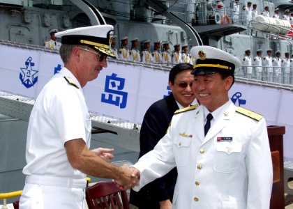 US Navy 060906-N-0879R-006 Commander, Navy Region Hawaii, Rear Adm. T. G. Alexander greets Deputy Commander, North Sea Fleet, Rear Adm. Wang Fushan following the arrival of two ships representing China's Navy