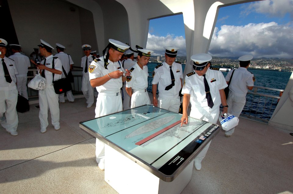 US Navy 060907-N-4965F-011 Chinese Sailors from the destroyer Qingdao (DDG 113) and oiler Hongzehu (AOR 881) view the USS Arizona Memorial during a historical white boat tour of Pearl Harbor