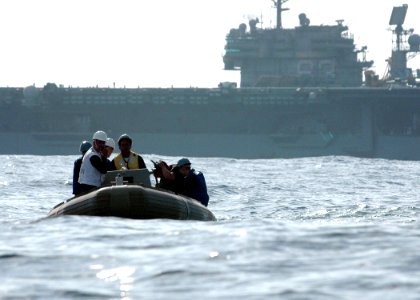 US Navy 061020-N-1332Y-195 Sailors from USS Kitty Hawk (CV 63) approach Oscar, a man overboard mannequin