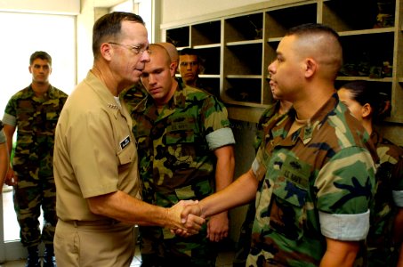 US Navy 060908-N-0696M-142 Chief of Naval Operations (CNO) Adm. Mike Mullen greets Equipment Operator 1st Class Anthony Alicea assigned to Naval Mobile Construction Battalion One Three Three (NMCB-133) after an all hands call