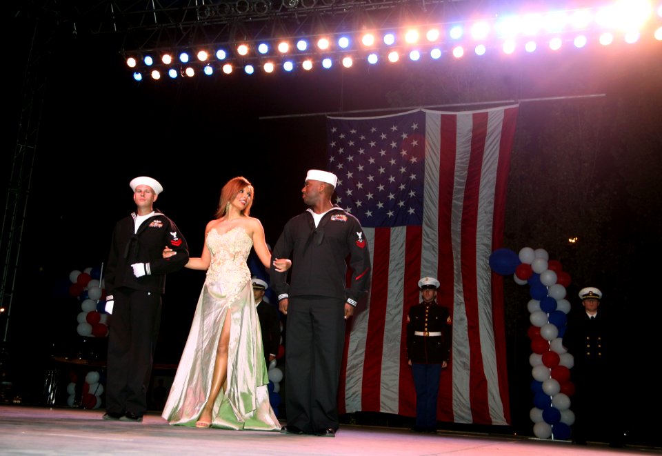 US Navy 060907-N-3271W-007 Area Sailors take part in the Miss Utah State Fair Competition by escorting the ladies during the evening gown competition