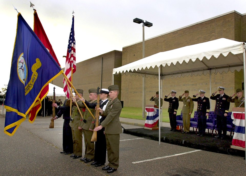 US Navy 061020-N-1082Z-001 The official party salutes as the colors are paraded at the Navy and Marine Corps Intelligence Training Center (NMITC) at Naval Air Station Oceana, Dam Neck Annex