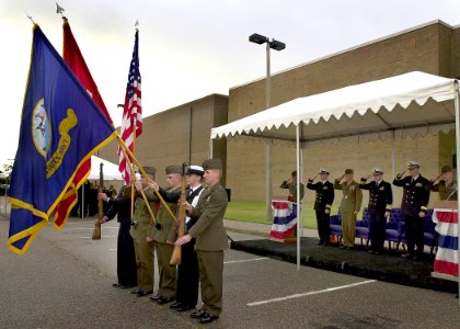 US Navy 061020-N-1082Z-001 The official party salutes as the colors are paraded at the Navy and Marine Corps Intelligence Training Center (NMITC) at Naval Air Station Oceana, Dam Neck Annex