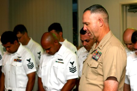 US Navy 060911-N-1113S-004 Command Chaplain Cmdr. Curtis D. Schmidtlein leads prospective chief petty officers and audience members in prayer during a 9-11 memorial ceremony photo