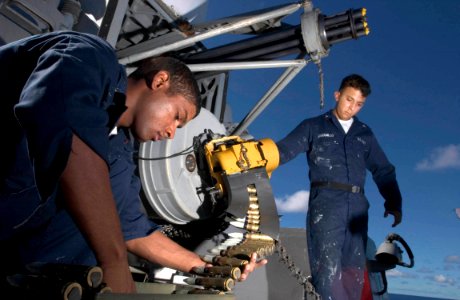 US Navy 060902-N-9851B-004 Fire Controlman 3rd Class Haneef Manboard and Fire Controlman 3rd Class Joseph Jaramillo download ammunition from a Close-In Weapons System