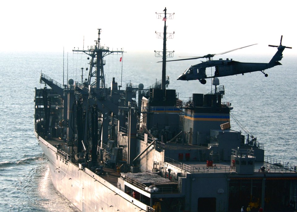 US Navy 060907-N-0490C-010 An MH-60S Seahawk helicopter, assigned to the Dragon Whalers of Helicopter Sea Combat Squadron Two Eight (HSC-28), picks up ordnance