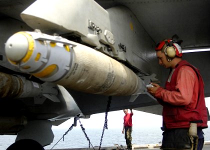 US Navy 060909-N-9742R-094 Aviation Ordnanceman 2nd Class Ryan Grogan, of Indianapolis, Ind., verifies component serial numbers on a GBU-38 Joint Attack Direct Munition