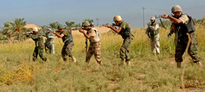 US Navy 060915-N-4097B-012 raqi army soldiers with 3rd Battalion, 4th Brigade, 1st Iraqi Army Division advance and fire at their targets during a live-fire exercise near Baqubah, Iraq