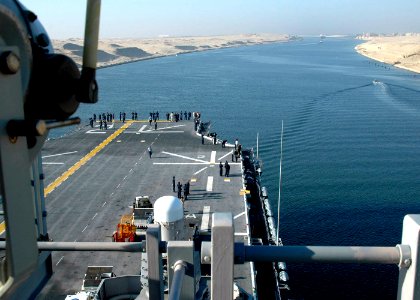 US Navy 060902-N-8547M-025 Sailors aboard the amphibious assault ship USS Saipan (LHA 2) view the scenery of Egypt from the ship's flight deck, as the ship transits south through the Suez Canal