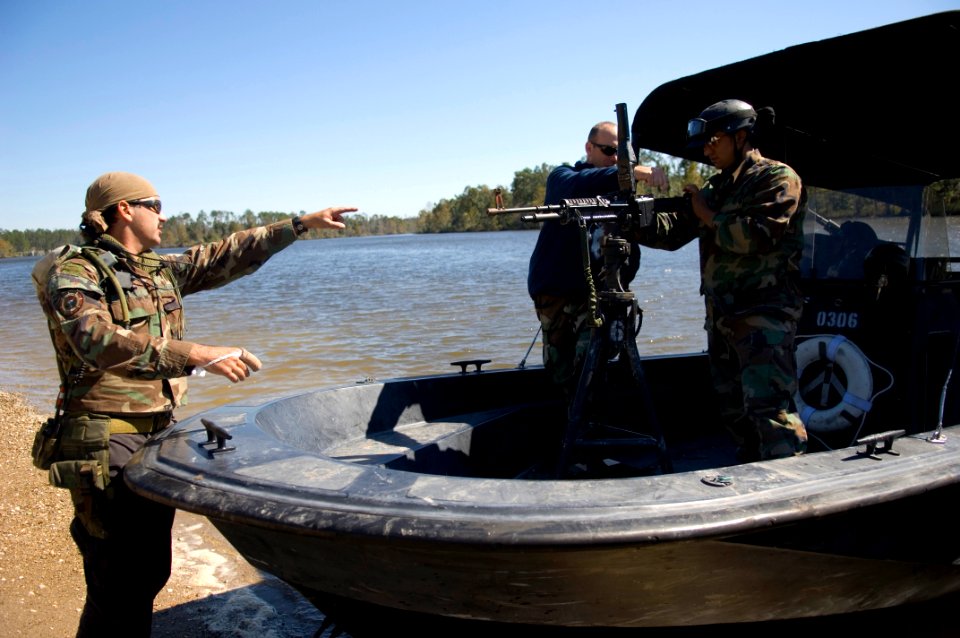 US Navy 061023-N-5319A-057 Sailors assigned to Naval Small Craft Instruction and Technical Training School (NAVSCIATTS) train personnel from the Iraqi Riverine Police Force on and weapon handling
