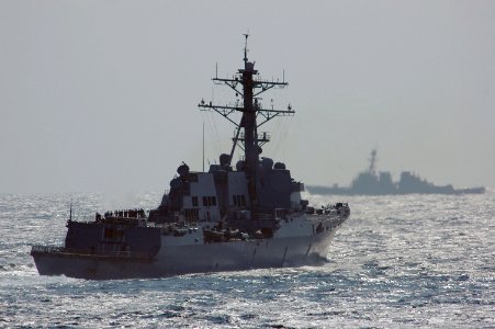 US Navy 061018-N-6106R-188 he Arleigh Burke-class guided missile destroyer USS Mustin (DDG 89) is shown sailing in the western Pacific Ocean