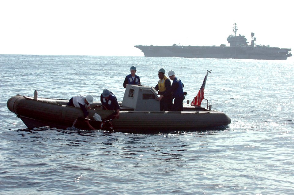 US Navy 061020-N-1332Y-249 USS Kitty Hawk (CV 63) Sailors pull the training mannequin