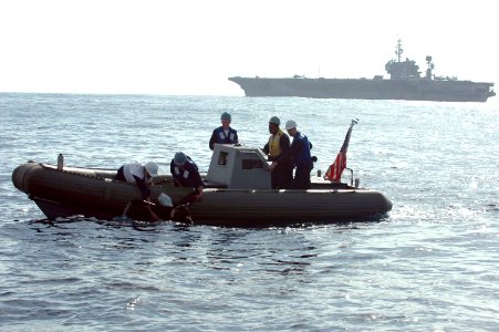US Navy 061020-N-1332Y-249 USS Kitty Hawk (CV 63) Sailors pull the training mannequin