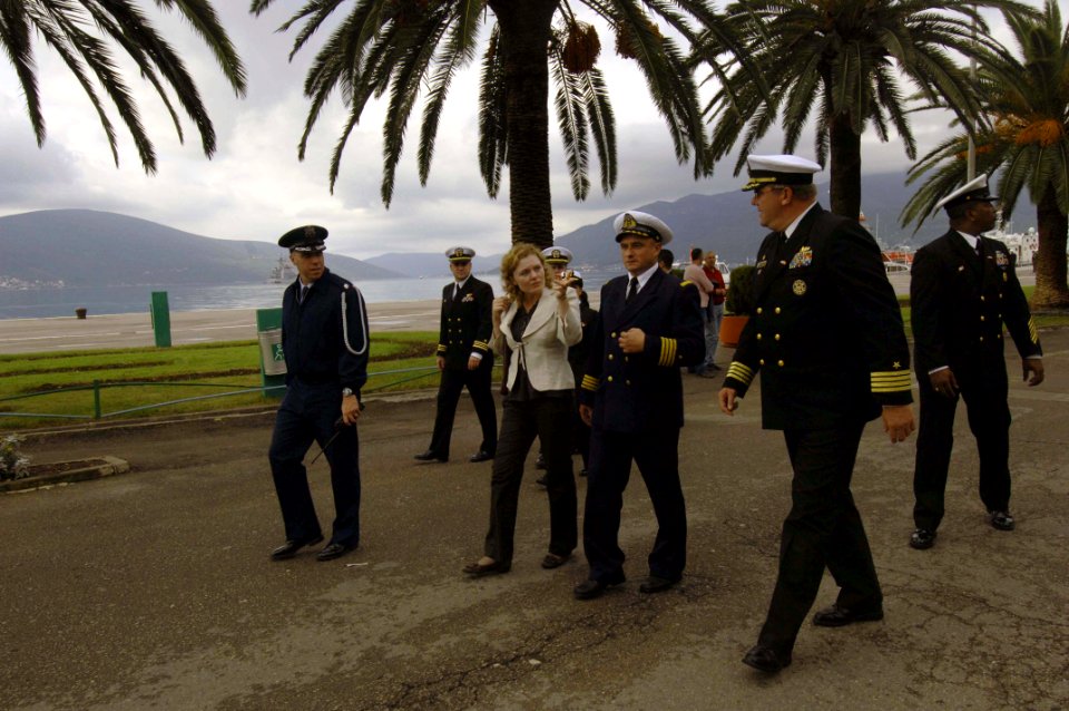 US Navy 061023-N-5330L-218 Capt. Perry Bingham, right, commanding officer of the guided-missile cruiser USS Anzio (CG 68), takes a walk through Tivat, Montenegro, with a Montenegrin representative after Anzio pulled into port
