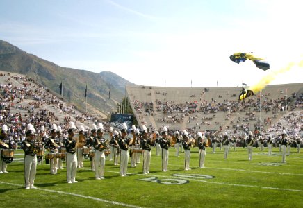 US Navy 060909-N-3271W-003 Lt. Geoff Reeves, a member of the U.S. Navy Parachute Demonstration Team Leap Frogs, prepares to land while the band plays at the pre-game ceremonie