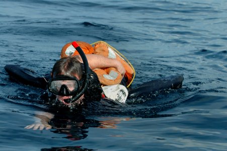 US Navy 061020-N-1332Y-031 Aviation Ordnanceman Airman Tim Tuttle from Washington, N.J., pulls the 50-pound training mannequin