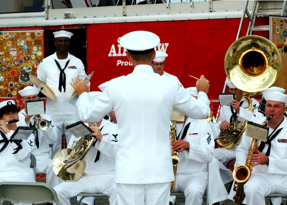 US Navy 061022-N-7427G-001 Master Chief Musician Willie Harris conducts the New Orleans Navy Band as they play the National Anthem for the N'awlins Air Show aboard Naval Air Station Joint Reserve Base, New Orleans