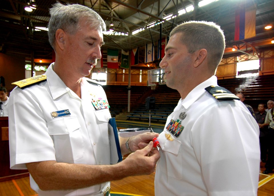US Navy 061019-N-4965F-001 Rear Adm. T. G. Alexander, Commander, Navy Region Hawaii, presents the Bronze Star on behalf of the President of the United States to Lt. Brian Skubin assigned to Explosive Ordnance Disposal Mobile Un