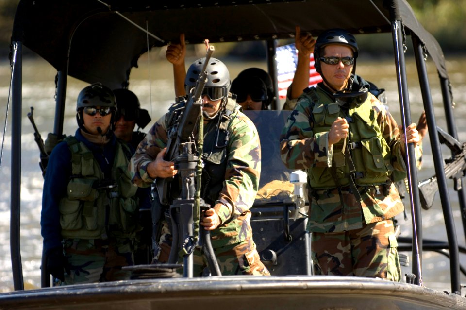 US Navy 061023-N-5319A-147 An Iraqi Soldier assigned to Iraqi Riverine Police Force mans a M-60 machine gun during special boat maneuvers and weapon handling training