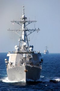 US Navy 061018-N-6106R-080 The Arleigh Burke-class guided missile destroyer USS John S. McCain (DDG 56) sails behind the aircraft carrier USS Kitty Hawk (CV 63)