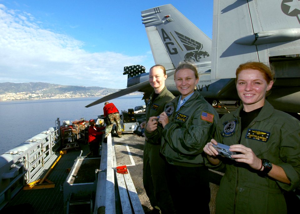 US Navy 061022-N-0490C-001 Search and Rescue (SAR) air crew team members from Helicopter Anti-Submarine Squadron Five (HS-5), take photos of the Sicilian coastline as the Nimitz-class aircraft carrier USS Dwight D. Eisenhower (