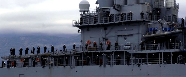 US Navy 061023-N-5330L-839 Sailors assigned to guided-missile cruiser USS Anzio (CG 68) man the rails as Anzio pulls into the port of Tivat, Montenegro