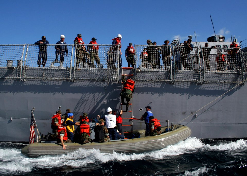 US Navy 061023-N-4953E-005 A visit, board, search, and seizure team assigned to guided-missile destroyer USS Stethem (DDG 63) and a Philippine Navy Special Operations Group (NAVSOG) board a rigid hull inflatable boat (RHIB)