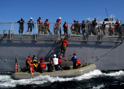 US Navy 061023-N-4953E-005 A visit, board, search, and seizure team assigned to guided-missile destroyer USS Stethem (DDG 63) and a Philippine Navy Special Operations Group (NAVSOG) board a rigid hull inflatable boat (RHIB)