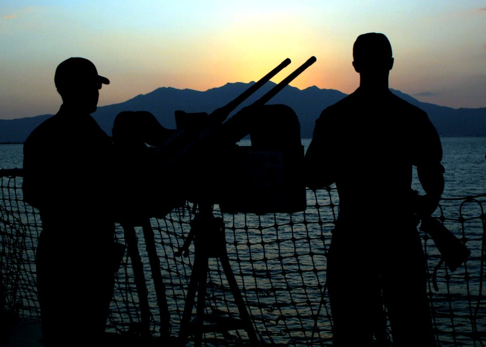 US Navy 061020-N-4953E-004 Gunner's Mate 2nd Class Paul Larson (Left) and Gunner's Mate 2nd Class Shawn Carrier stand Force Protection watch on aboard the guided missile destroyer USS Stethem (DDG 63) while moored