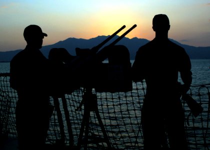 US Navy 061020-N-4953E-004 Gunner's Mate 2nd Class Paul Larson (Left) and Gunner's Mate 2nd Class Shawn Carrier stand Force Protection watch on aboard the guided missile destroyer USS Stethem (DDG 63) while moored