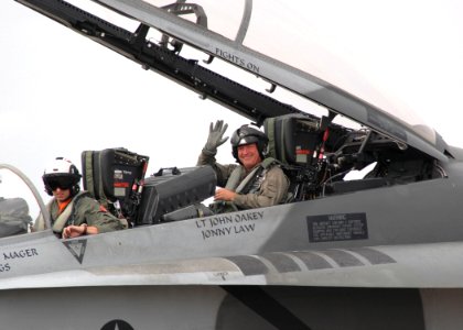 US Navy 061022-N-7427G-002 Capt. Walter J. Adelmann, commanding officer of Naval Air Station Joint Reserve Base, New Orleans, prepares for flight in the F-A-18B during the N'awlins Air Show hosted by the base